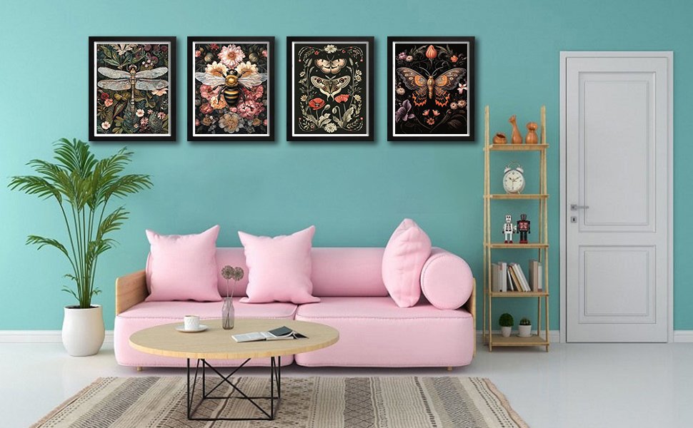 Four framed diamond painting kits featuring a dragonfly, bee, moth, and butterfly displayed on a teal wall above a pink sofa.