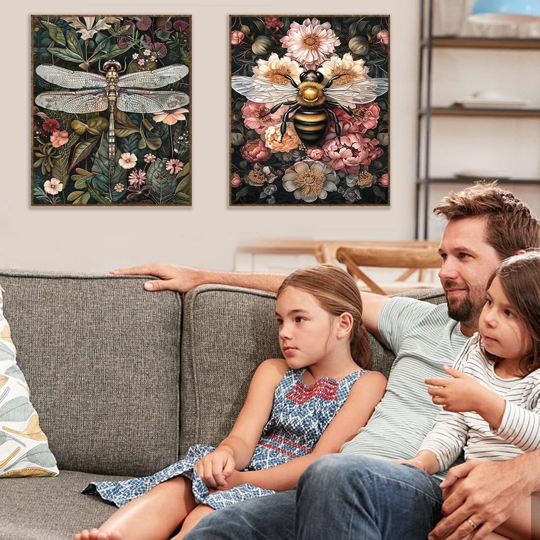 Family watching TV with framed diamond art paintings of a dragonfly and a bee on the wall
