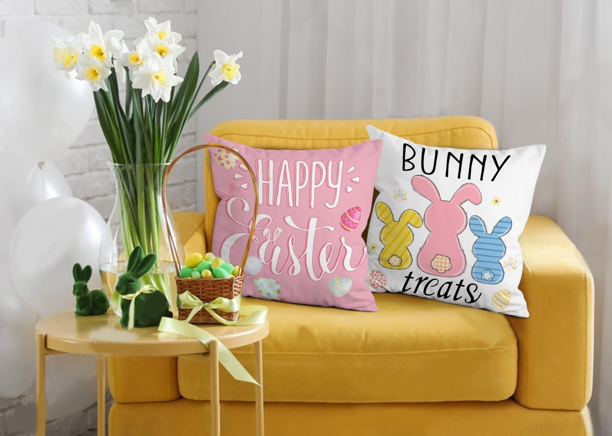 Two Easter-themed throw pillow covers on a yellow couch, one pink with 'Happy Easter' and the other white with bunnies and 'Bunny treats'.
