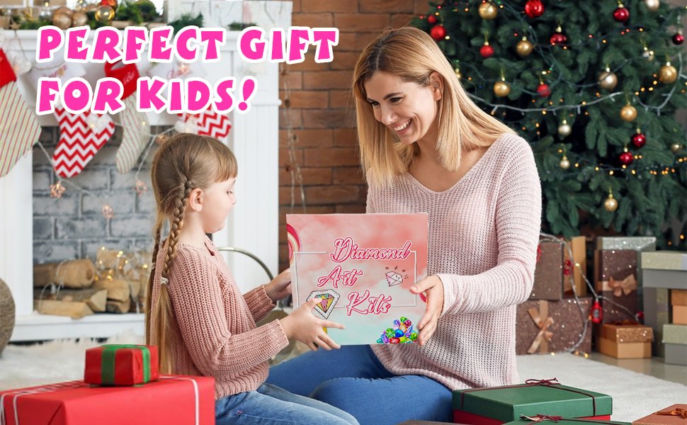 Mother and daughter exchanging a diamond art kit box in a festive Christmas setting with a decorated tree and fireplace.
