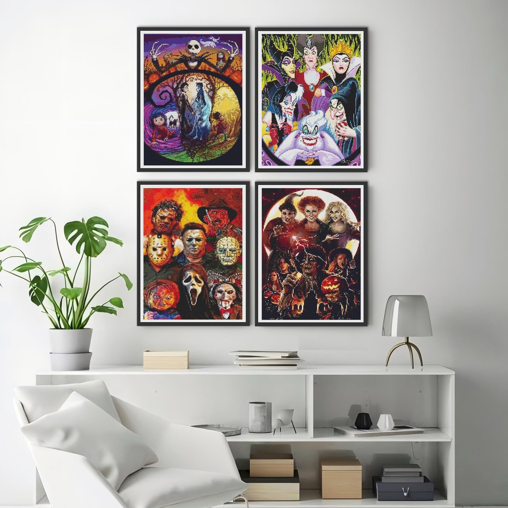 Four framed diamond art paintings of horror and cartoon characters displayed on a white shelf.
