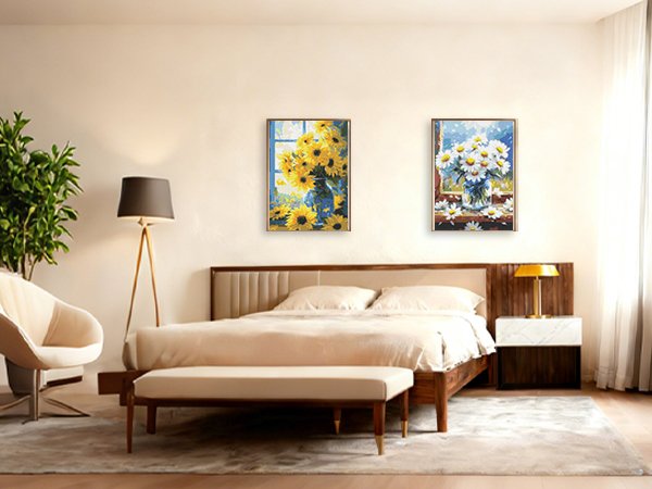 Bedroom scene with two framed floral diamond paintings hanging above a bed, featuring sunflowers and daisies.