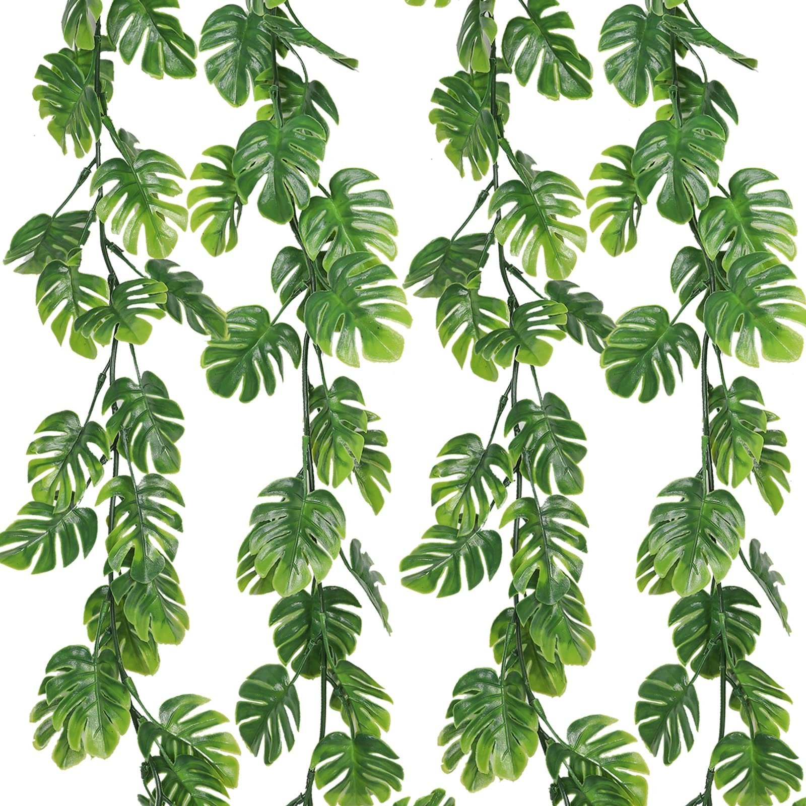 Four artificial monstera vines with green leaves cascading against a white background.