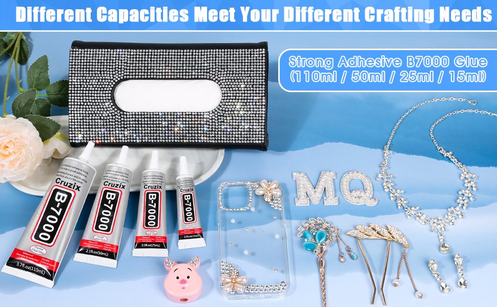 Four tubes of clear adhesive glue and various rhinestone craft supplies including a tissue box cover, phone case, necklace, and hairpins.