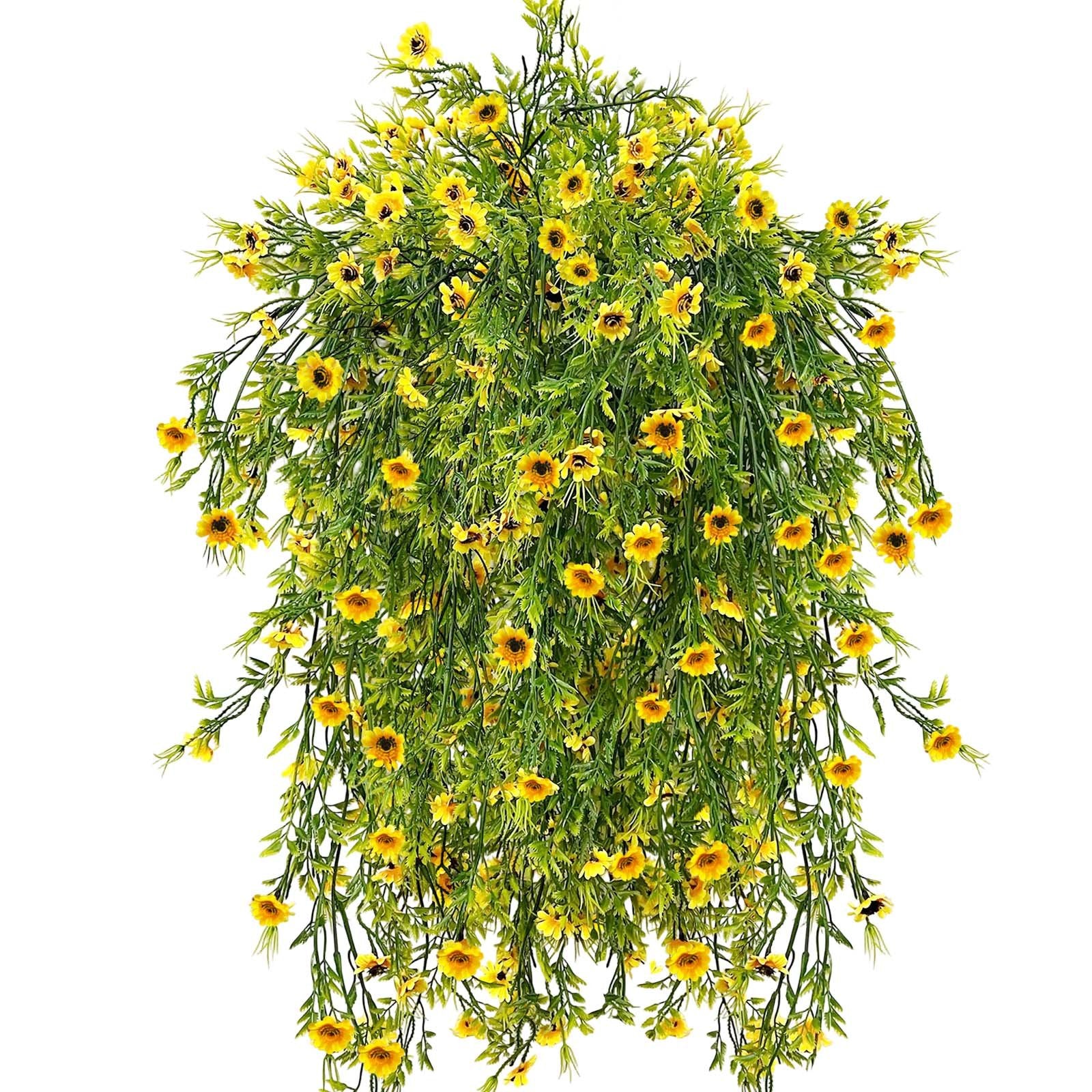 Cascading artificial hanging daisy plant with bright yellow flowers and green foliage against a white background.