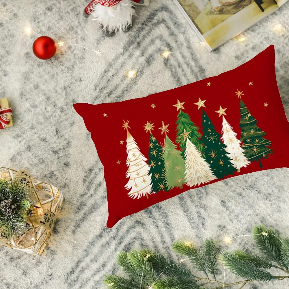 Rectangular Christmas pillow cover with red background and green and white trees with gold stars