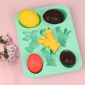 Easter silicone mold with yellow bunny, red and yellow eggs, and chocolate half eggs