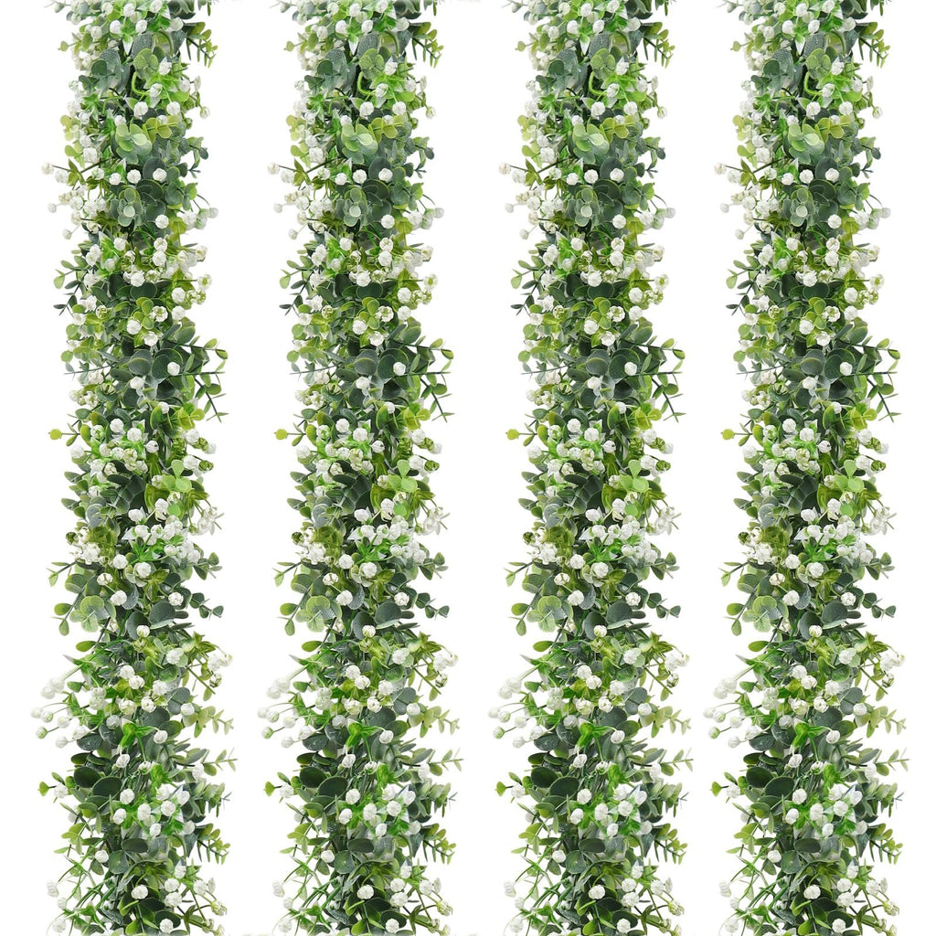 Four strands of faux eucalyptus garland with white flowers on a white background