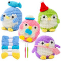 Four crocheted penguins in blue, pink, green, and purple, with yarn skeins and crochet hooks.