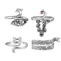 Four adjustable knitting crochet loop rings in silver: peacock, cat, and two patterned designs.