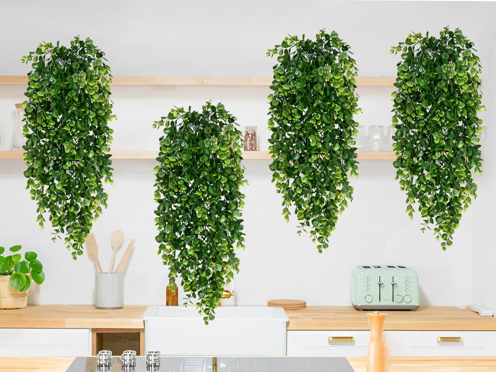 Four artificial hanging eucalyptus plants with green leaves displayed in a kitchen setting.