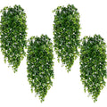 Four artificial hanging eucalyptus plants with green leaves cascading down against a white background.