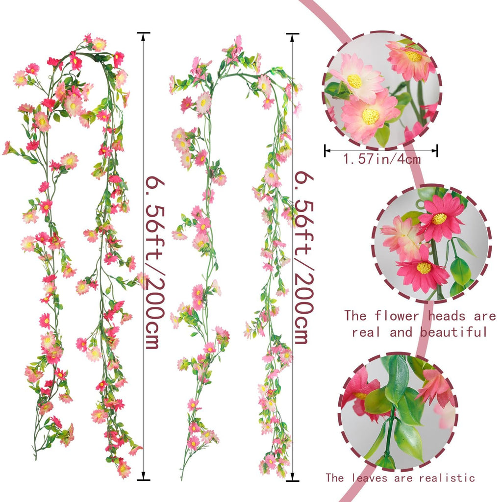 Two artificial daisy flower garlands with pink and rose red flowers and green leaves, shown against a white background with close-up details.