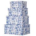 Stack of four blue and white floral patterned storage boxes with silver label holders.