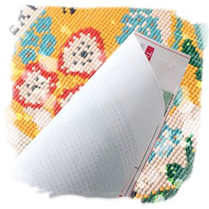 Diamond art painting canvas with floral design partially unrolled, showing adhesive backing and grid lines.