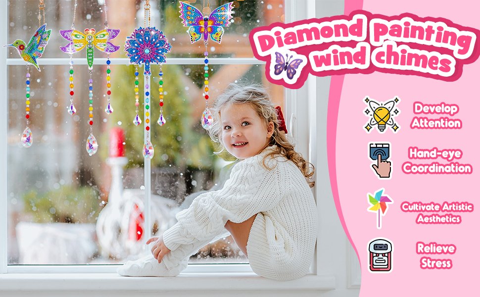 Smiling child sitting on a windowsill with diamond painting wind chimes hanging in the window