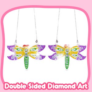 Two double-sided diamond painting dragonfly wind chimes hanging by chains, with pink border.
