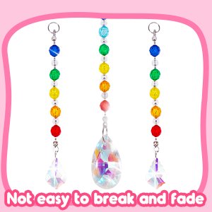 Three crystal suncatcher wind chimes with colorful beads hanging against a white background.
