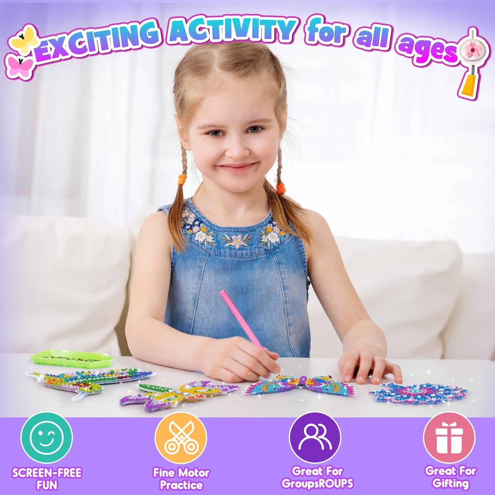 Young girl doing diamond painting on acrylic bird, butterfly, flower, and dragonfly shapes at a table.