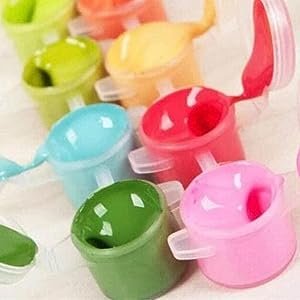 Close-up of colorful paint pots with lids open, showing various shades of paint inside.