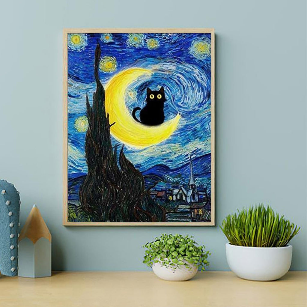 Paint by number canvas featuring a black cat sitting on a crescent moon against a swirling starry night sky, framed and displayed on a shelf.