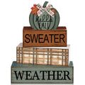 Stack of four wooden fall-themed decor blocks with a pumpkin on top, reading 'hello FALL', 'SWEATER', and 'WEATHER'.