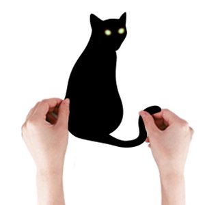 Two hands holding a large black cat Halloween window cling with glowing green eyes