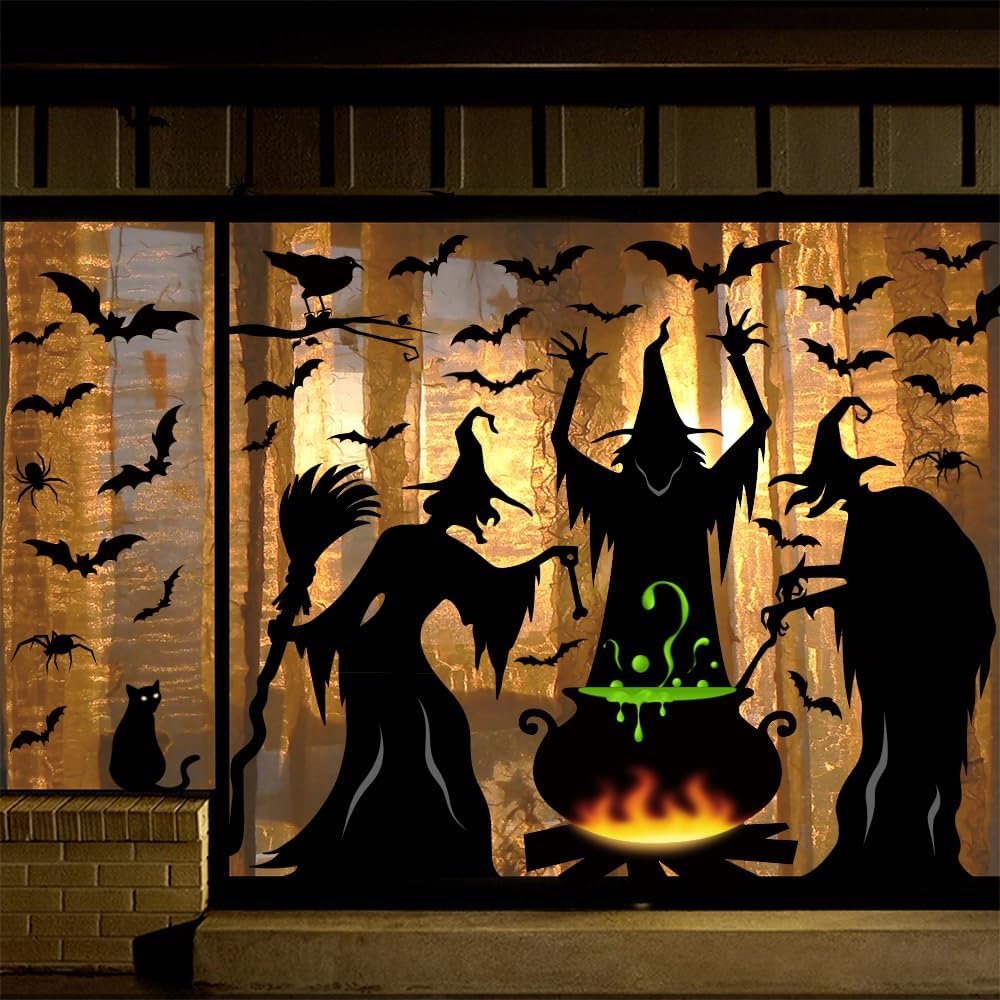 Halloween window clings featuring witches, a black cat, bats, spiders, and a cauldron with green bubbling potion.