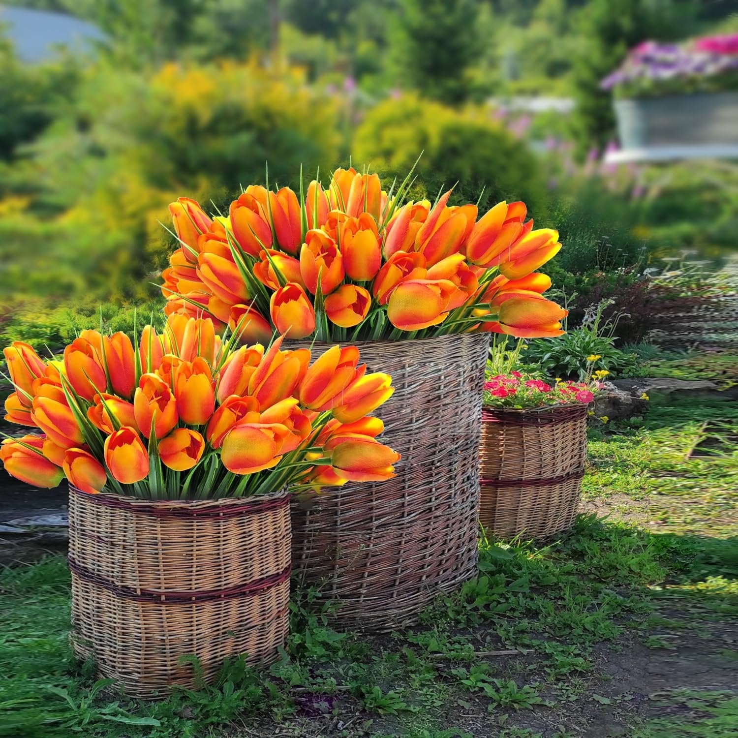 Two large wicker baskets filled with orange artificial tulips, set in a garden with blurred green foliage and flowers.