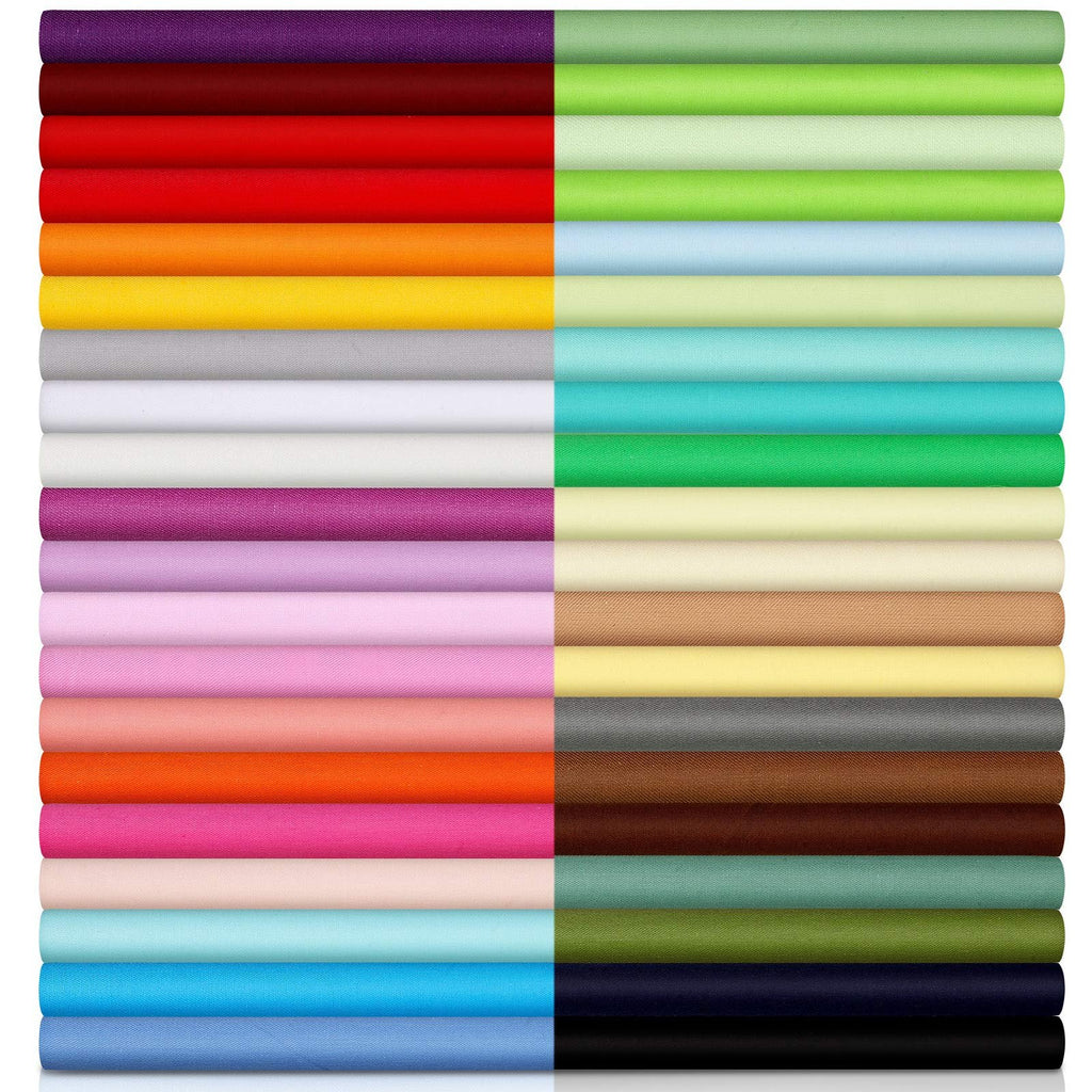 Forty rolled fabric squares in a rainbow of solid colors, neatly stacked in two columns against a white background.