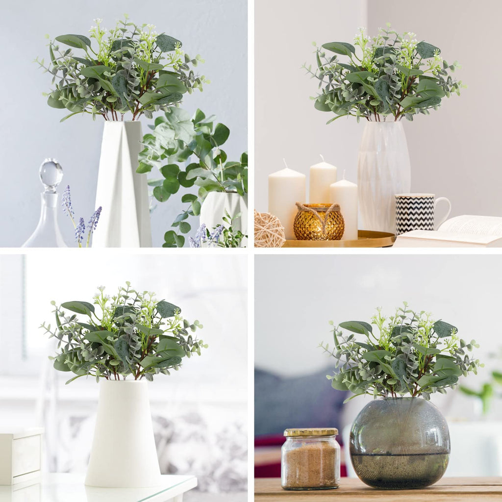 Four arrangements of artificial eucalyptus stems with silver dollar and baby leaves in vases, candles, and jars.