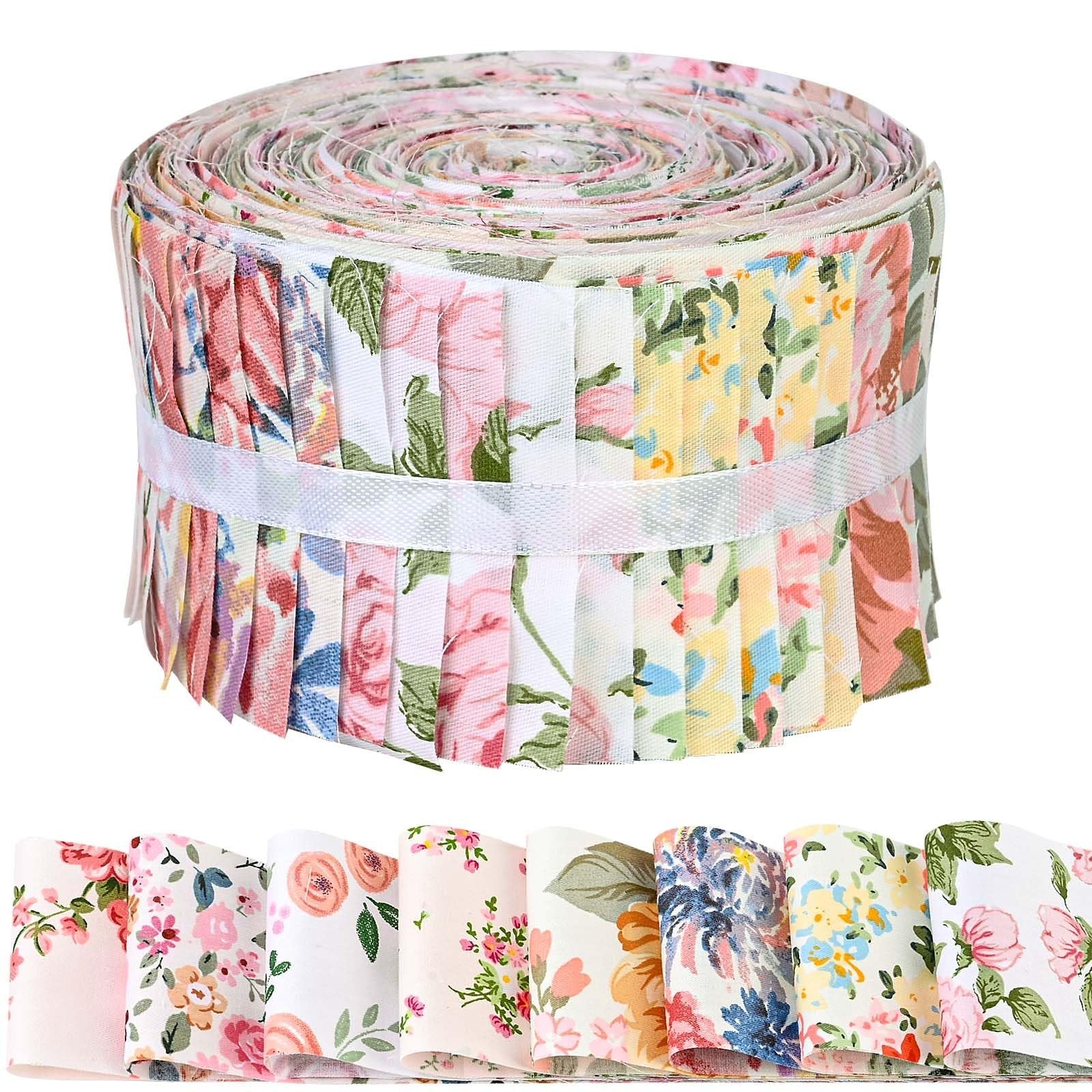 Rolled jelly roll of pink retro floral cotton fabric strips with a white band, shown with individual strips fanned out below.