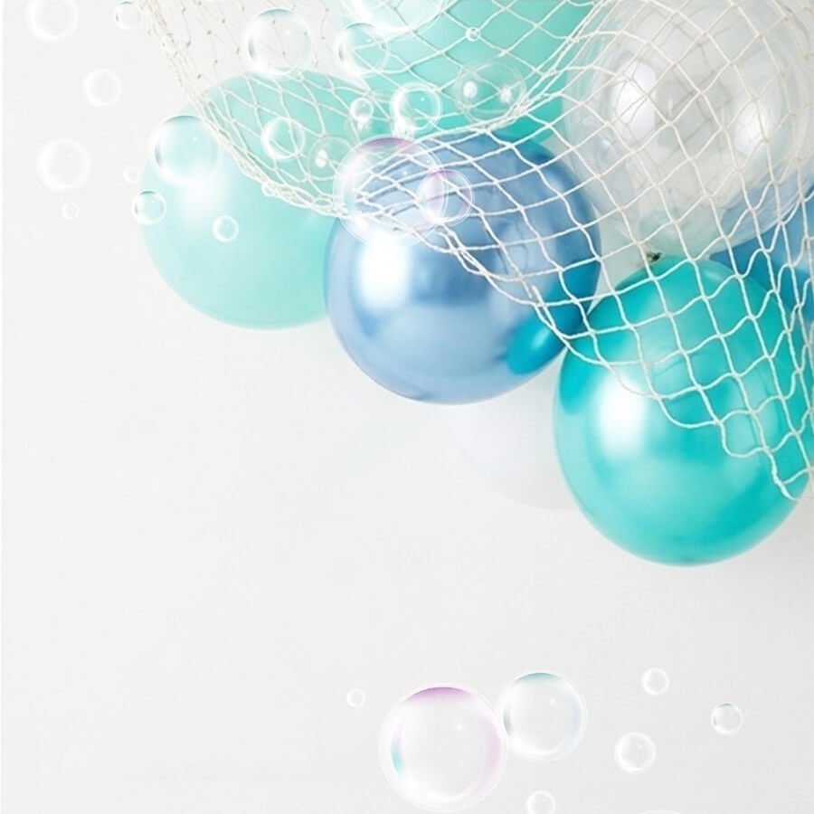 Assortment of teal, turquoise, blue, and clear pearl metallic balloons in a white net with bubbles