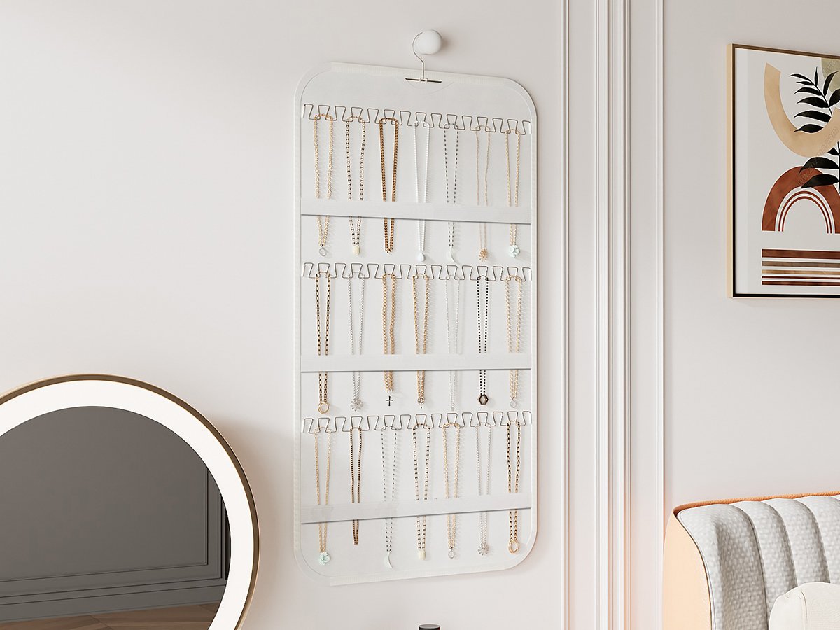 White double-sided hanging jewelry organizer with 40 pockets and 36 hooks, displaying various necklaces.