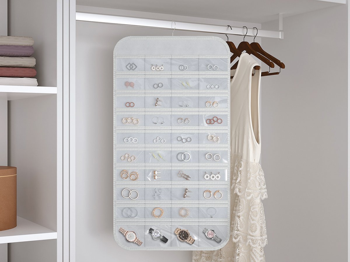 Double-sided hanging jewelry organizer with 40 clear pockets and 36 hooks, shown in a closet with stacked clothes and a dress.