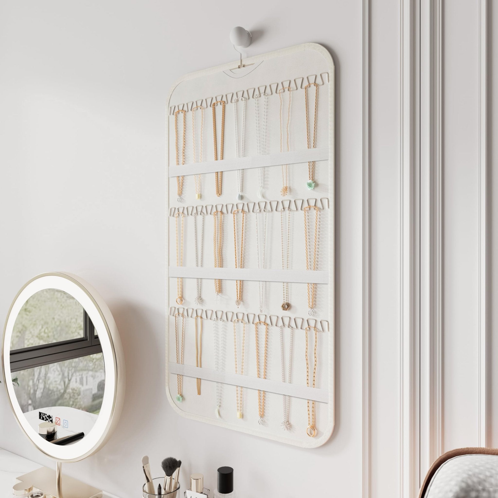 White double-sided hanging jewelry organizer with 40 pockets and 36 hooks, displaying various necklaces.