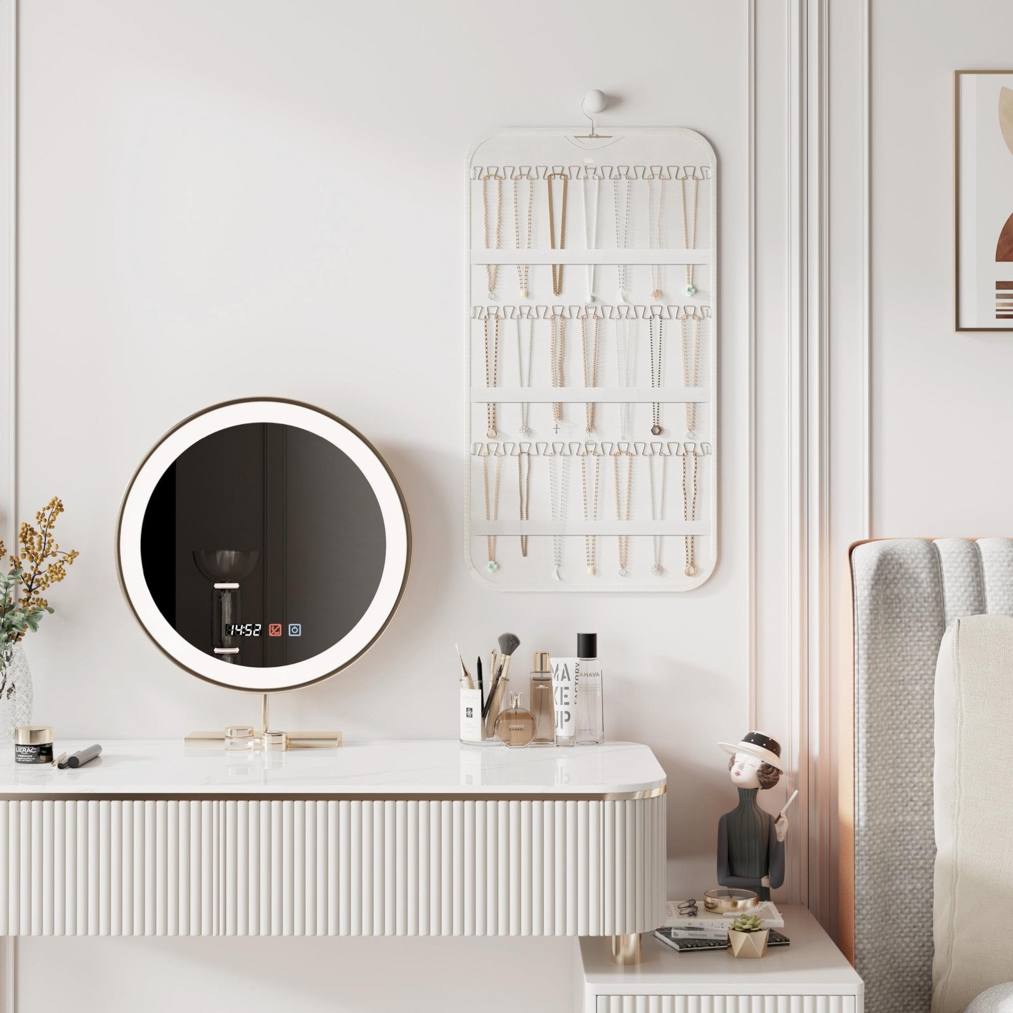 White double-sided hanging jewelry organizer with 40 pockets and 36 hooks, displayed on a wall above a vanity with a lighted mirror.