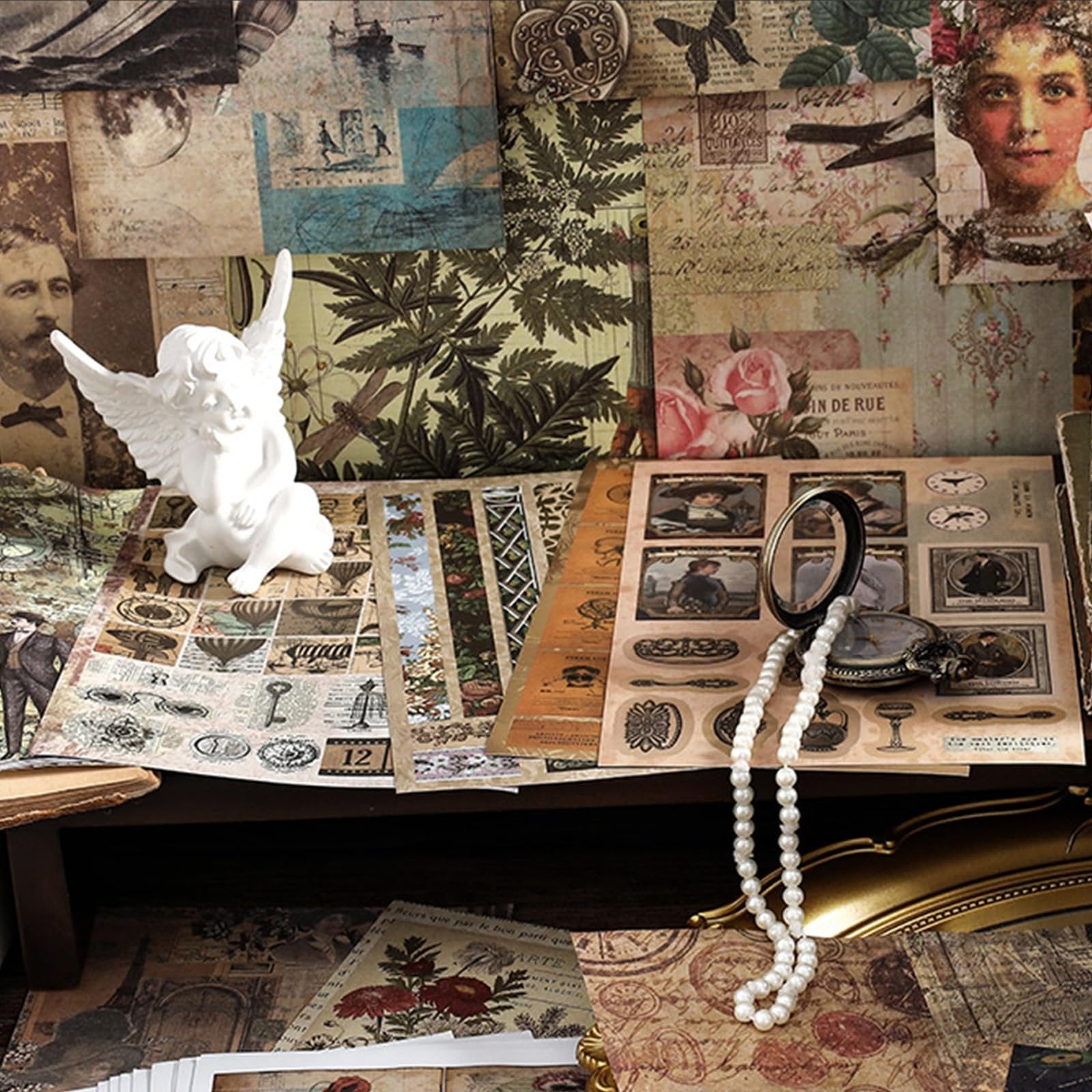 Vintage nature forest ephemera book and washi stickers with a white angel figurine and pearl necklace