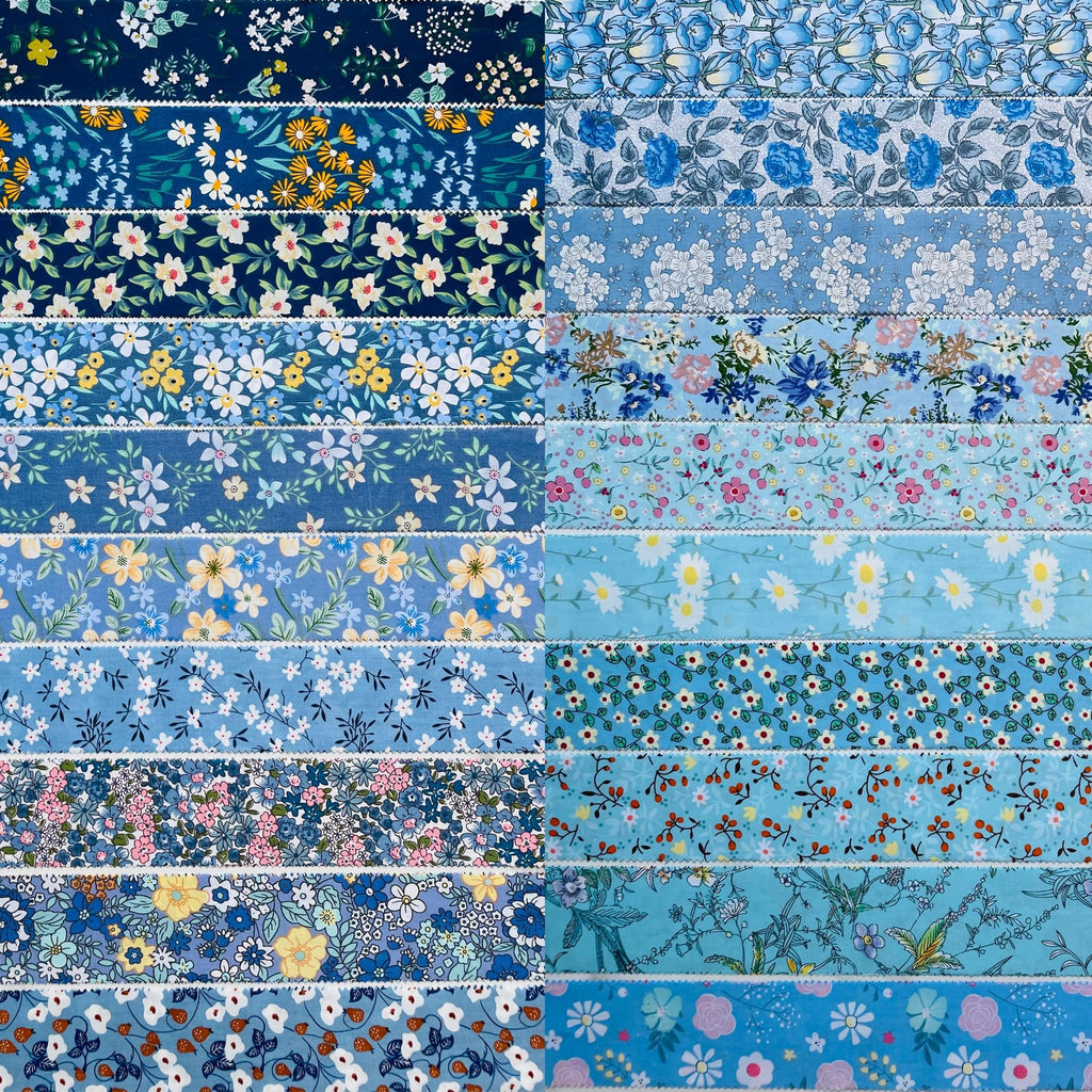 Collection of 40 cotton fabric strips with floral and botanical prints in various shades of blue and some yellow and white accents, arranged in a grid.