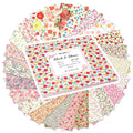 Stack of 42 floral print 10x10 inch cotton fabric squares, fanned out