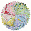 A circular arrangement of 42 floral cotton fabric squares for quilting and crafts, displayed on a white background.
