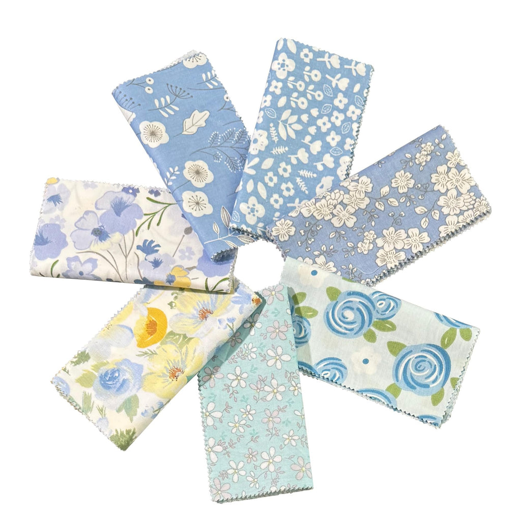 Assortment of 5-inch blue floral fabric squares arranged in a circle on a white background.