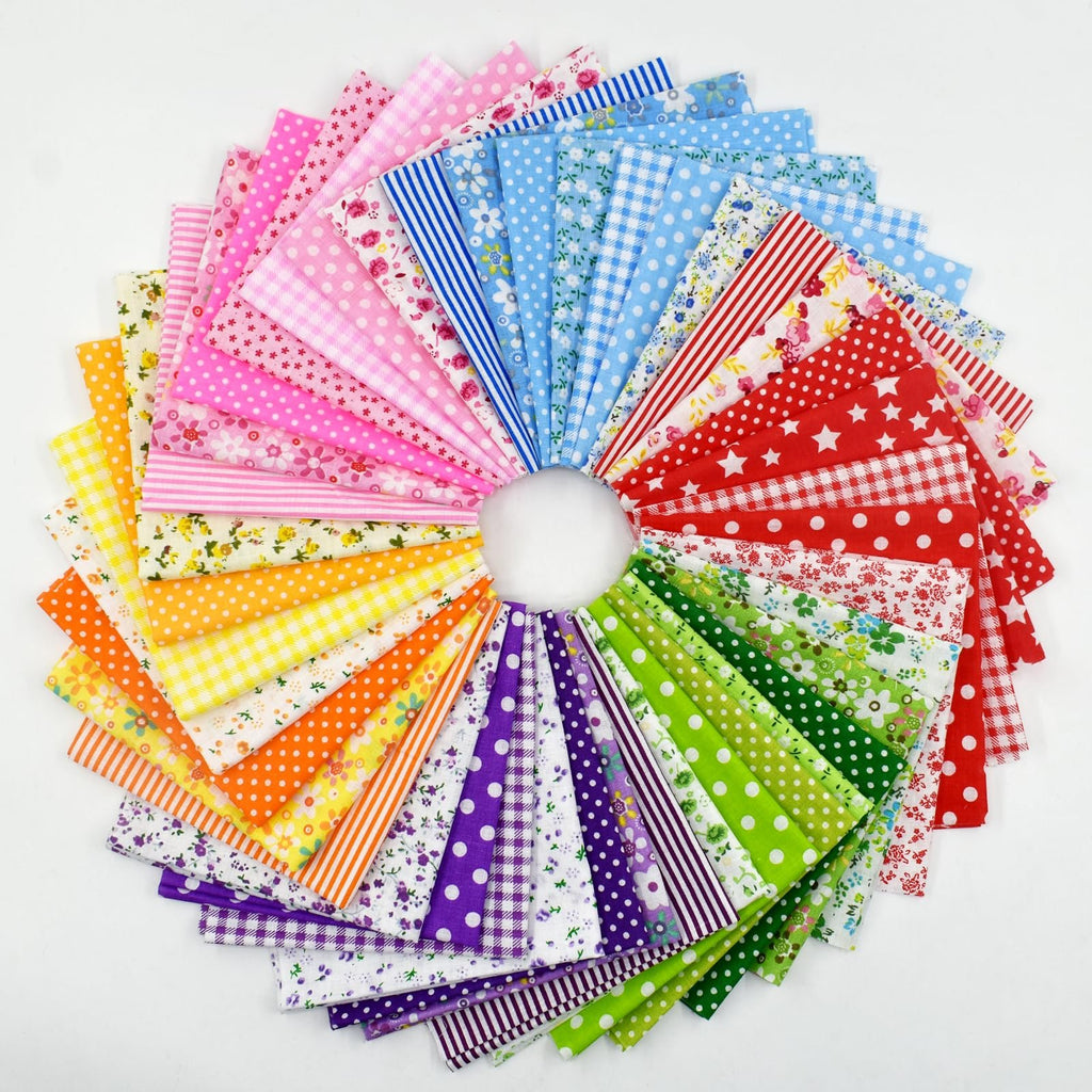 Fan arrangement of 42 cotton quilting fabric squares in various patterns and colors including polka dots, stripes, floral, and stars.