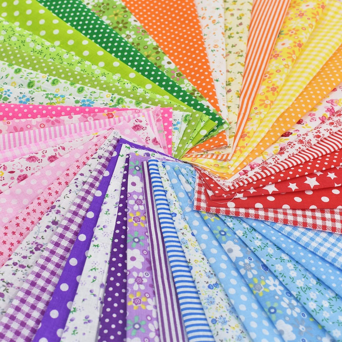 Swirl of colorful floral and polka dot cotton fabric squares for quilting and sewing