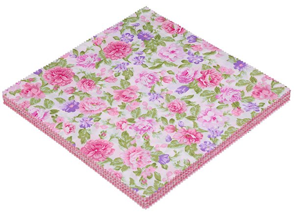 Stack of 42 precut 5x5 inch cotton fabric squares with a pink floral pattern, angled view.