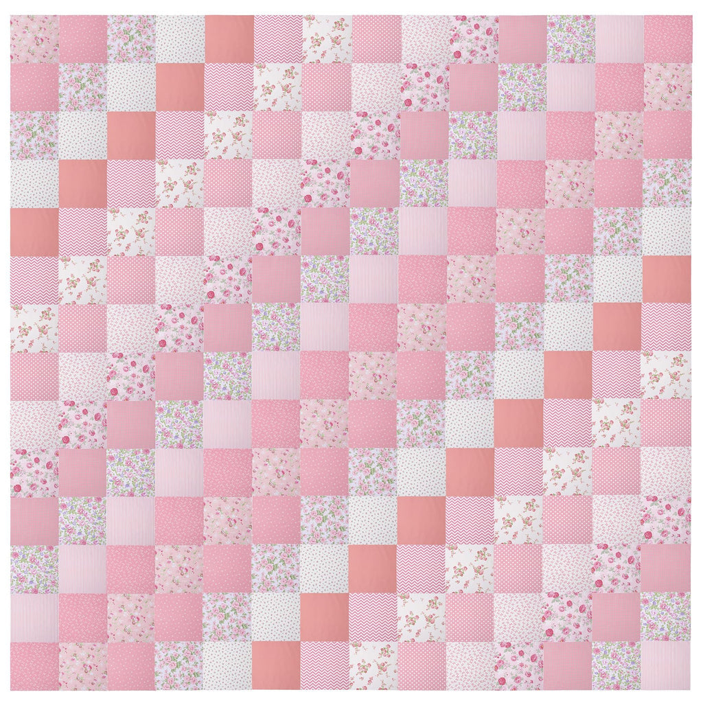 Pink and white floral, polka dot, chevron, and striped fabric squares arranged in a quilt pattern.