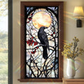 Gothic raven stained glass style window film on a window, featuring a raven perched on branches with red berries against a moonlit sky.