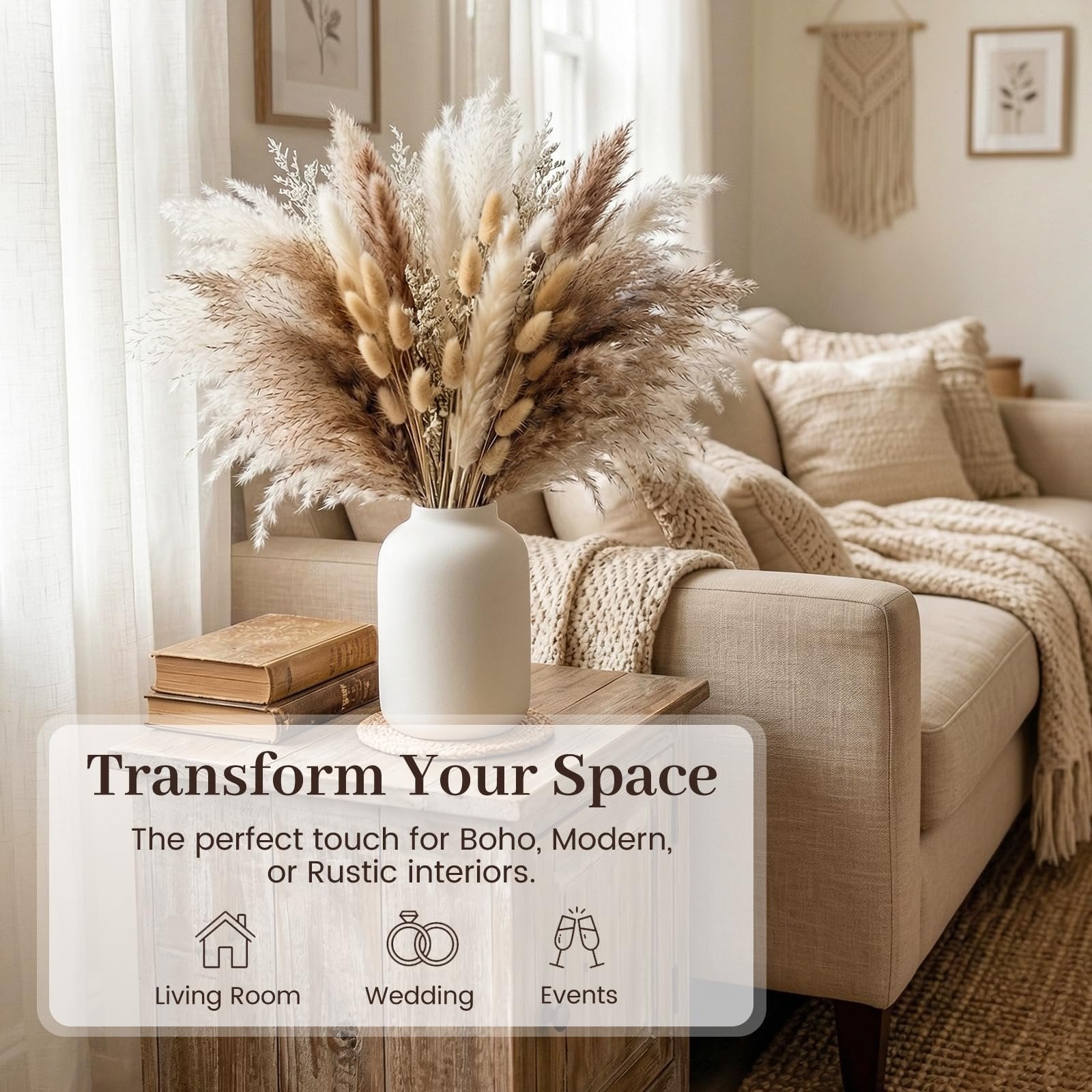 Boho dried pampas grass and bunny tail arrangement in a white vase on a side table next to a sofa.