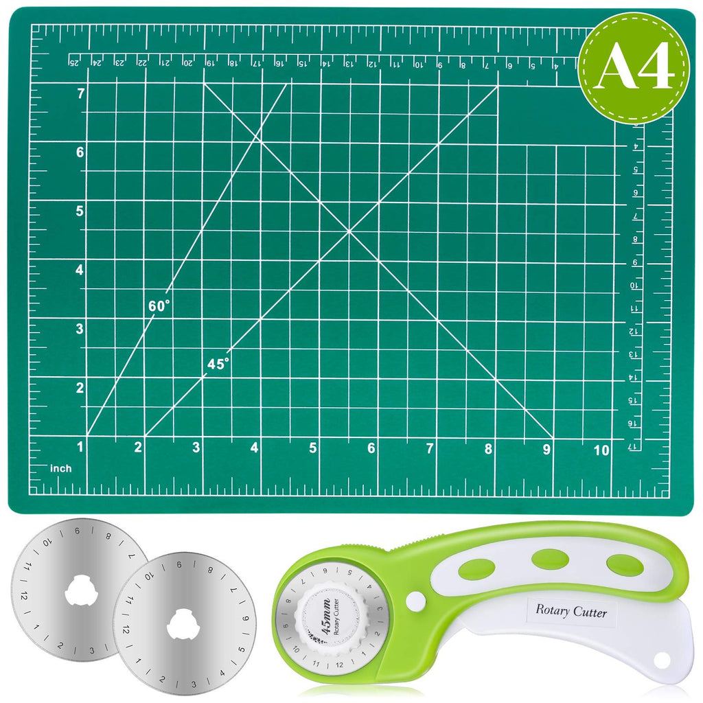 Green self-healing cutting mat with grid lines, angles, and inch/cm rulers, shown with a 45mm rotary cutter and two replacement blades.