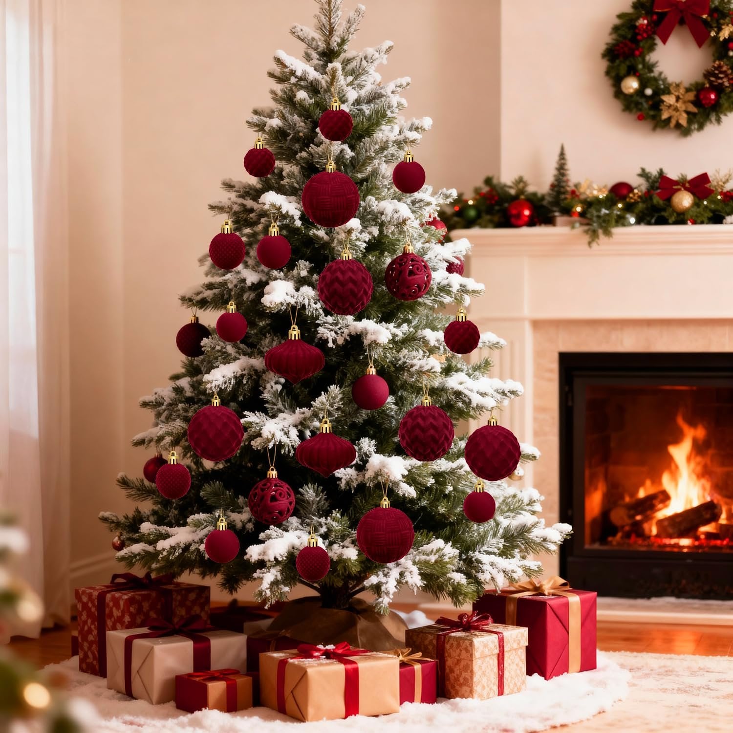 Flocked Christmas tree decorated with burgundy ornaments and gifts underneath, fireplace with a wreath above.